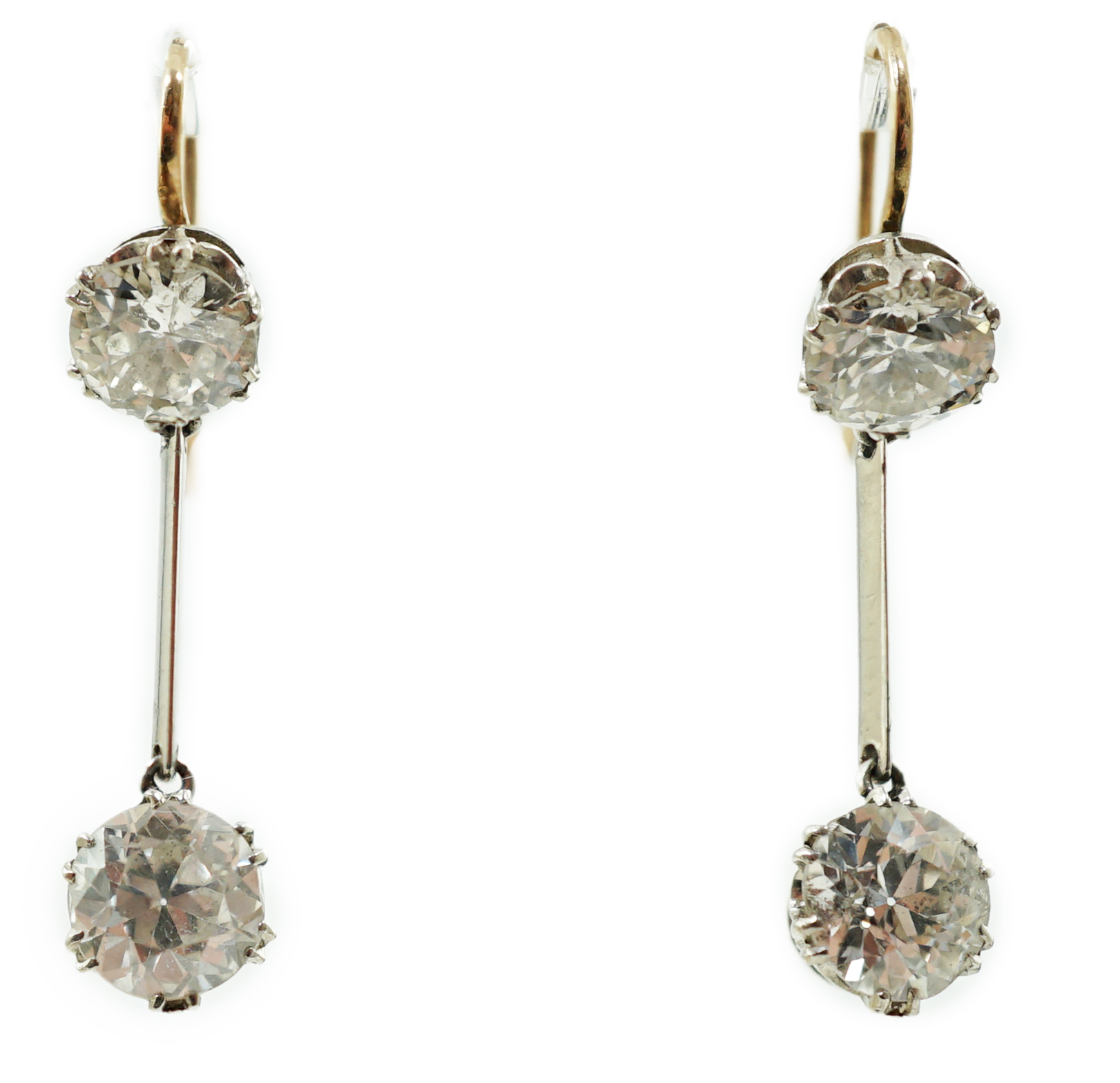 A pair of gold and graduated two stone diamond set drop earrings